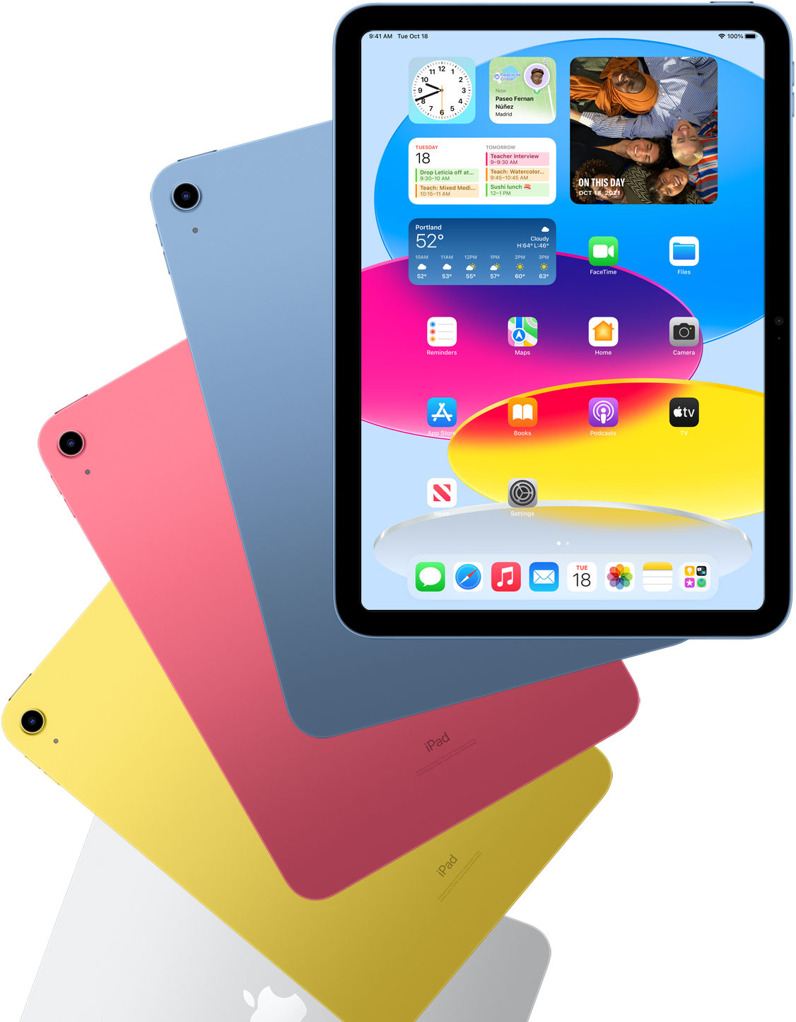 Front view iPad shows home screen with blue, pink, yellow, and silver rear facing iPads behind it.
