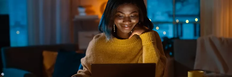 Woman using her laptop while in another country