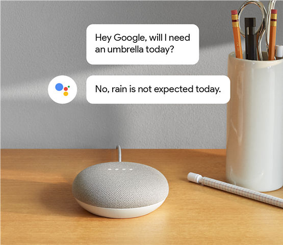 Google Home Mini with comment bubbles floating above – indicating conversation. 'Hey Google, will I need an umbrella today?' 'No, rain is not expected today.'