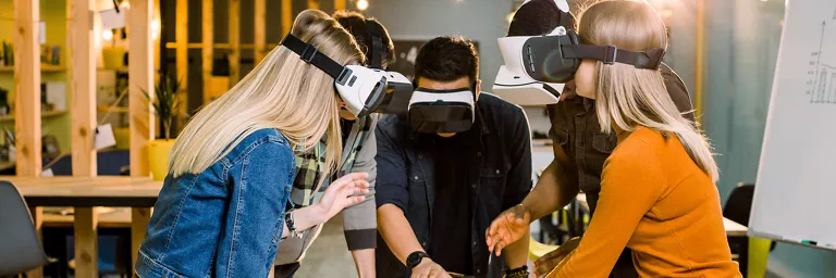 5 people using a VR headset to visualize a project