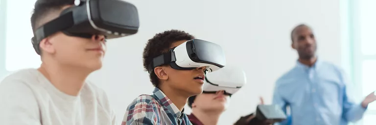 Kids using VR headsets for educational purposes in school