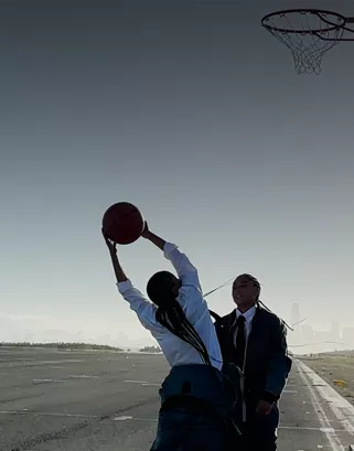 A frame from a video of person catching a ball.