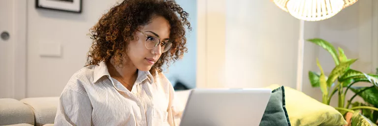 Woman with glasses on computer