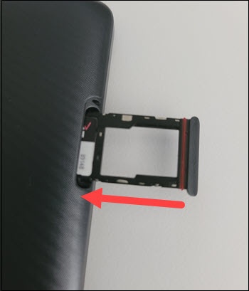 Insert SIM / SD tray