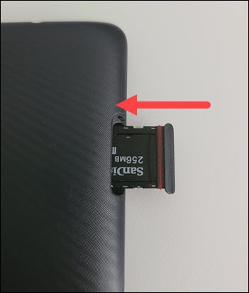 Insert SIM / SD tray