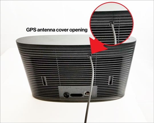 GPS antenna opening with cable threaded through